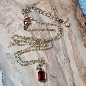 Elegant Gold Necklace with Red Pendant